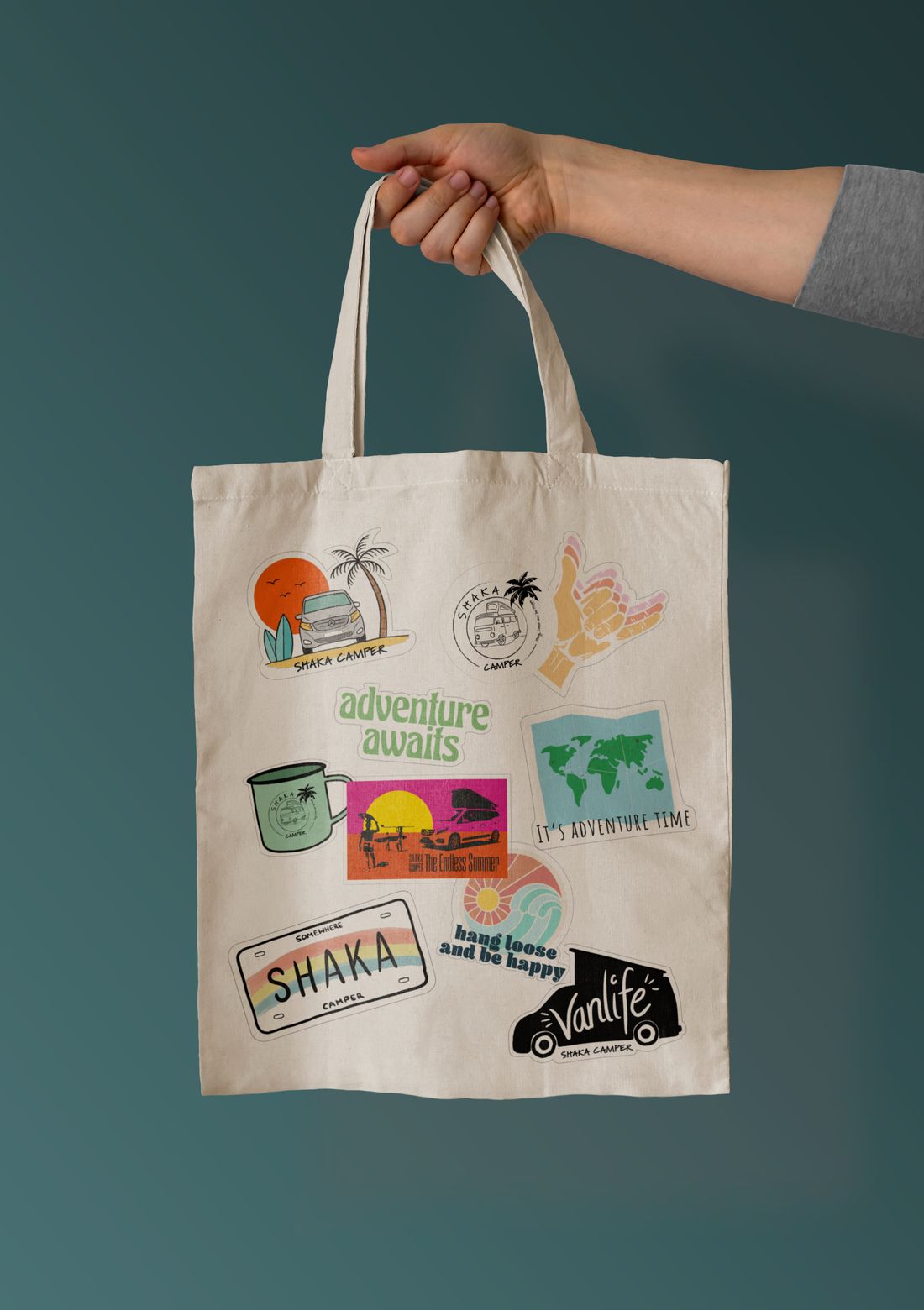 Tote bag covered in Shaka Camper stickers